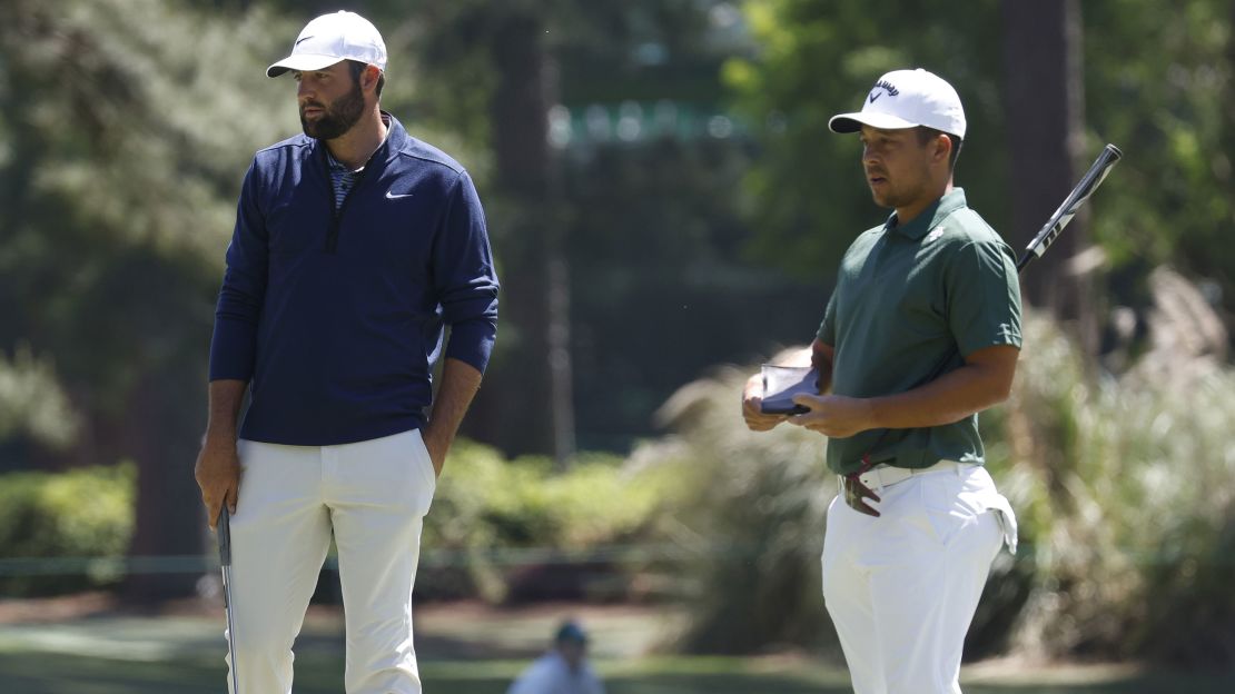 Scheffler (left) and Schauffele wait to putt at this year's Masters Tournament.