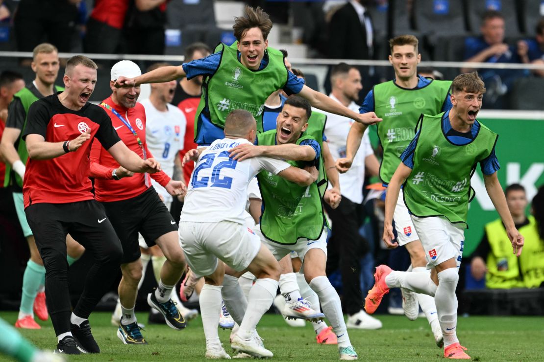 Slovakia's players celebrate beating Belgium in their opening Euro 2024 game.