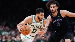 Jun 6, 2024; Boston, Massachusetts, USA; Boston Celtics forward Jayson Tatum (0) controls the ball against Dallas Mavericks center Dereck Lively II (2) in the third quarter during game one of the 2024 NBA Finals at TD Garden. Mandatory Credit: David Butler II-USA TODAY Sports