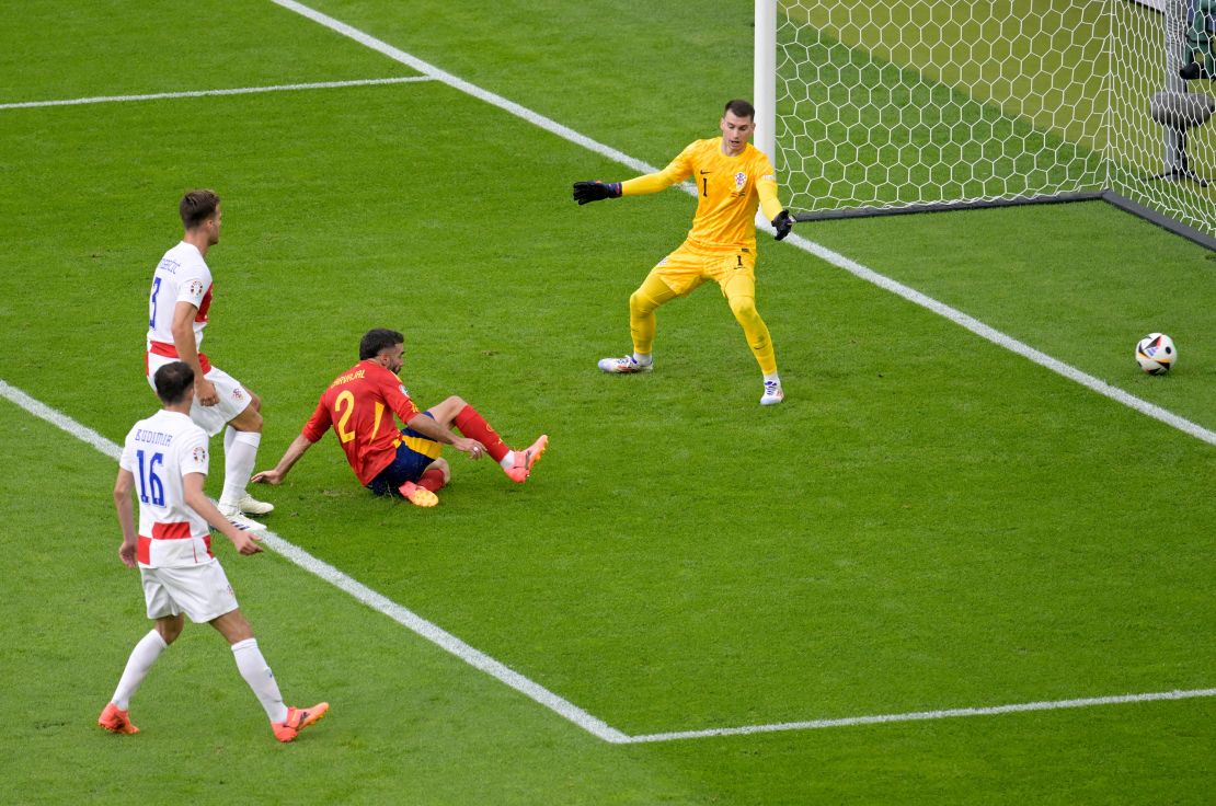 Carvajal slides in to give Spain a 3-0 lead.