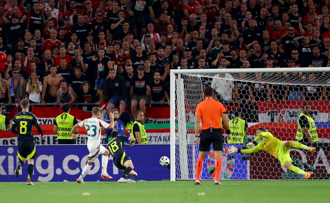 Csoboth scores for Hungary past Scotland goalkeeper Angus Gunn.