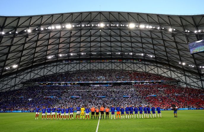 Soccer players from France and the United States line up before the start of their match on Wednesday, July 24.