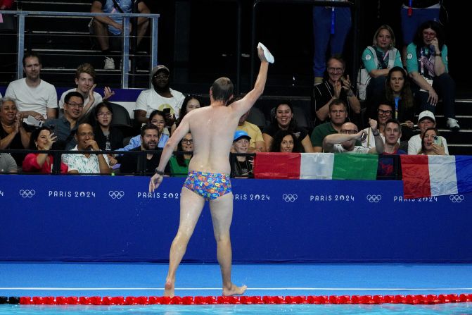 The crowd cheers for a lifeguard after he went into the pool to recover the swim cap of US swimmer Emma Weber on July 28. Lifeguards like this are common at swimming competitions, but it still provided a moment of levity in between races. <a href="https://www.cnn.com/2024/07/28/sport/olympic-moment-lifeguard-swimming-spt-intl/index.html">NBC's commentary crew deemed him “Bob the Cap Catcher.”</a> The lifeguard declined to release his name, a Paris 2024 spokesperson said, so that he could keep the focus on his duties.