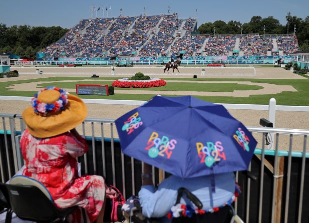 Spectators watch Finnish dressage rider Emma Kanerva on July 30.