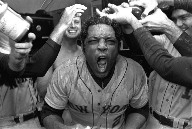 Teammates douse Mays with champagne in their locker room at Wrigley Field in Chicago, Illinois, on October 1, 1973. The Mets had just defeated the Chicago Cubs 6-4 to take the National League East division championship.