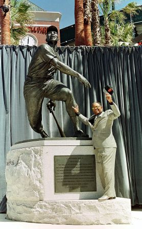 Mays stands next to a statue of himself during its dedication by the San Francisco Giants, at 24 Willie Mays Plaza, in front of Pacific Bell Park in San Francisco on March 31, 2000.