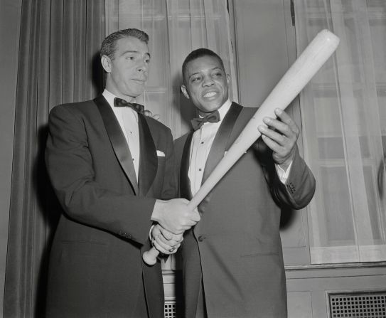 Mays, right, gets batting tips from Joe DiMiaggio, at the 32nd annual dinner of the Baseball Writers at the Waldorf Astoria in 1955. Mays, the reigning National League MVP, won the Scribes' Sid Mercer Award as "Player of The Year."