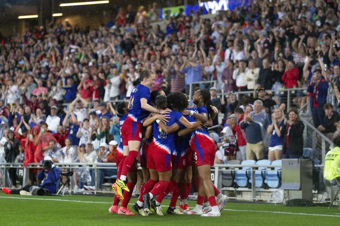 US players celebrate together after Yohannes scored her debut goal.