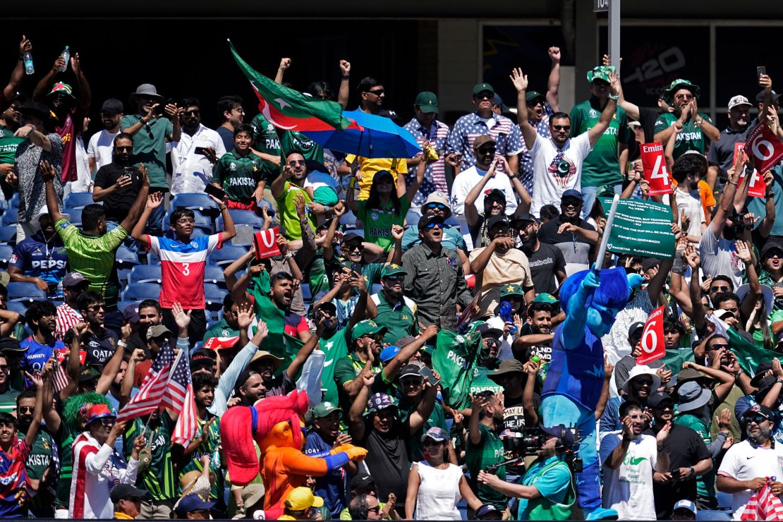 Fans react after a boundary hit by Pakistan.