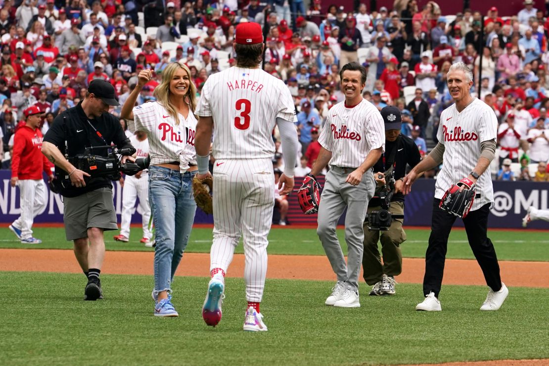 Kaitlin Olson (far left), McElhenney (second from right), former Philadelphia Phillies second baseman Chase Utley (far right) and Harper participate in opening ceremonies.