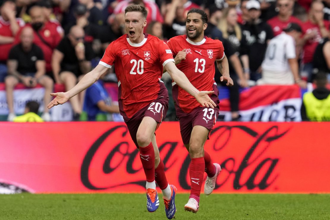 Michel Aebischer celebrates after scoring Switzerland's second goal.