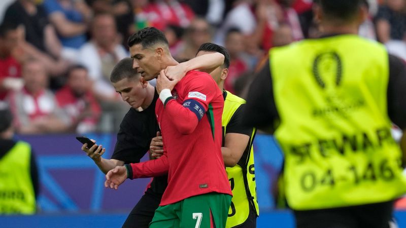 Portugal manager expresses ‘concern’ after several fans invade pitch at Euro 2024 to take a selfie with Cristiano Ronaldo