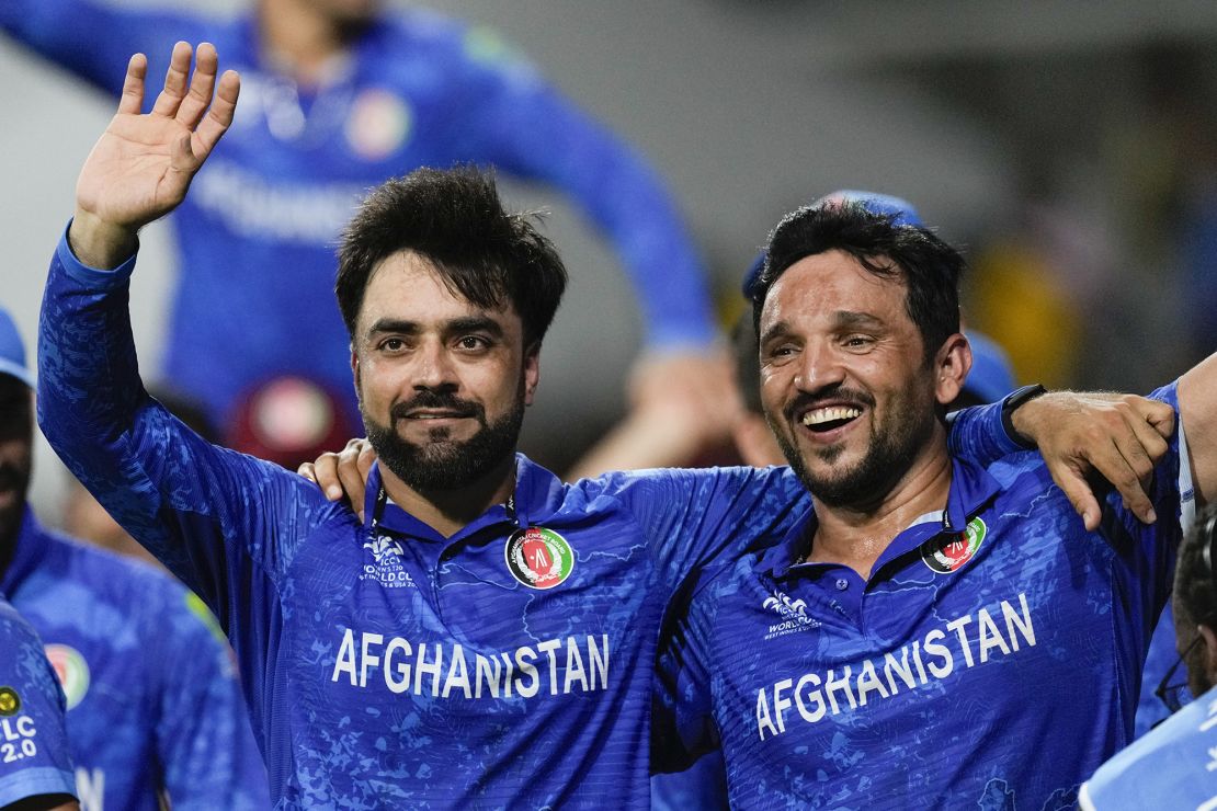 Khan (left) and Naib (right) celebrate after defeating Bangladesh by eight runs.