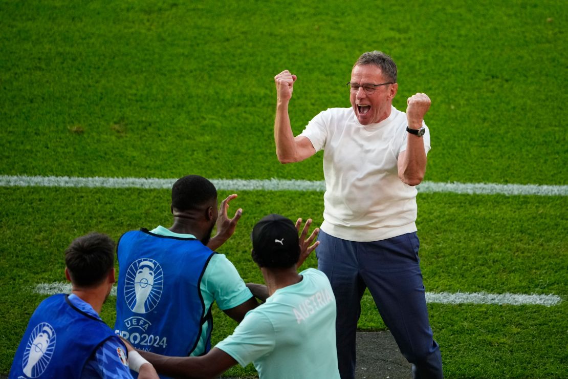 Austria's head coach Ralf Rangnick celebrates victory over the Netherlands.