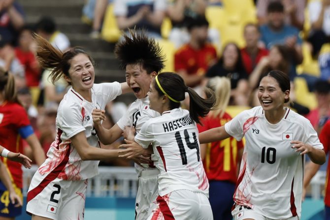 Japan's Aoba Fujino, second from left, celebrates with teammates after scoring against Spain on July 25. But Spain won the match 2-1.