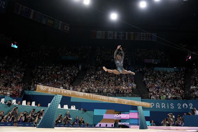 US gymnast Simone Biles competes on the balance beam during the Olympic qualification round on July 28. <a href="https://www.cnn.com/2024/07/28/sport/simone-biles-return-paris-olympics-2024-spt-intl/index.html">She landed awkwardly</a> while warming up for her floor routine, but <a href="https://www.cnn.com/2024/07/28/sport/simone-biles-return-paris-olympics-2024-spt-intl/index.html">she fought through the pain</a> to post an impressive all-around score.