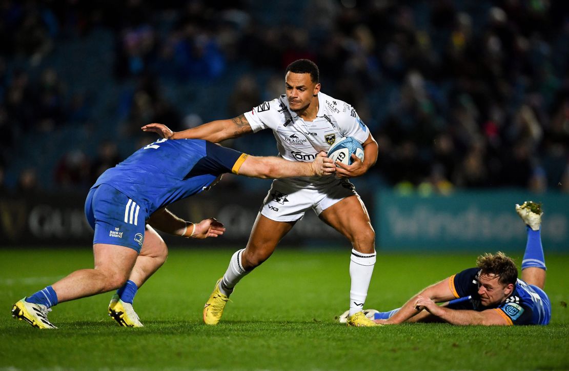 Hewitt carries the ball during a United Rugby Championship match between Leinster and Dragons in Dublin.