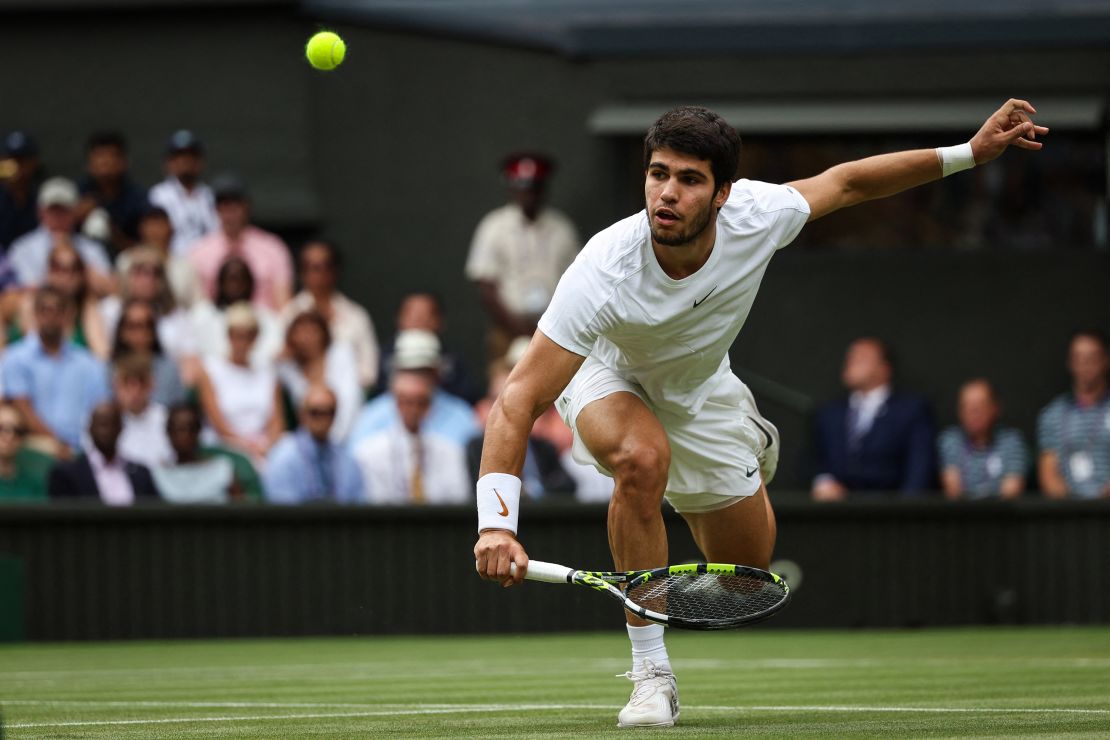 Alcaraz plays a return against Djokovic during last year's men's singles final.