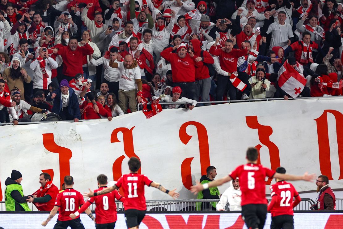 Georgia's players celebrate after winning Euro 2024 play-off final against Greece.