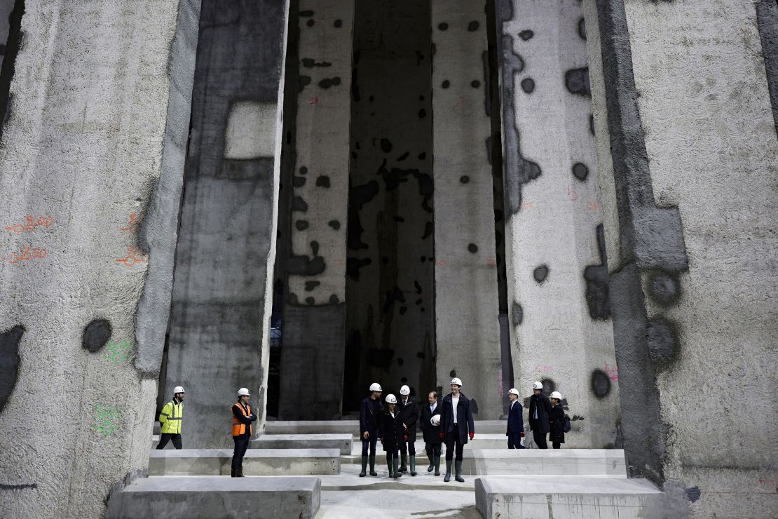 Paris' mayor Anne Hidalgo (C) and other officials attend the inauguration of the Austerlitz wastewater and rainwater storage basin, which is intended, among other things, to make the Seine swimmable during the Paris 2024 Olympic Games, in Paris on May 2, 2024. (Photo by STEPHANE DE SAKUTIN / POOL / AFP) (Photo by STEPHANE DE SAKUTIN/POOL/AFP via Getty Images)