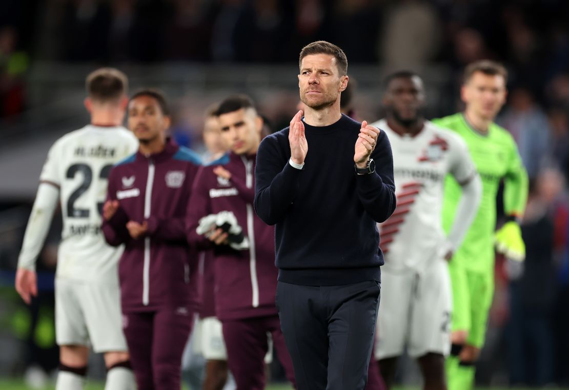 Alonso applauds the fans after Leverkusen's Europa League final defeat.