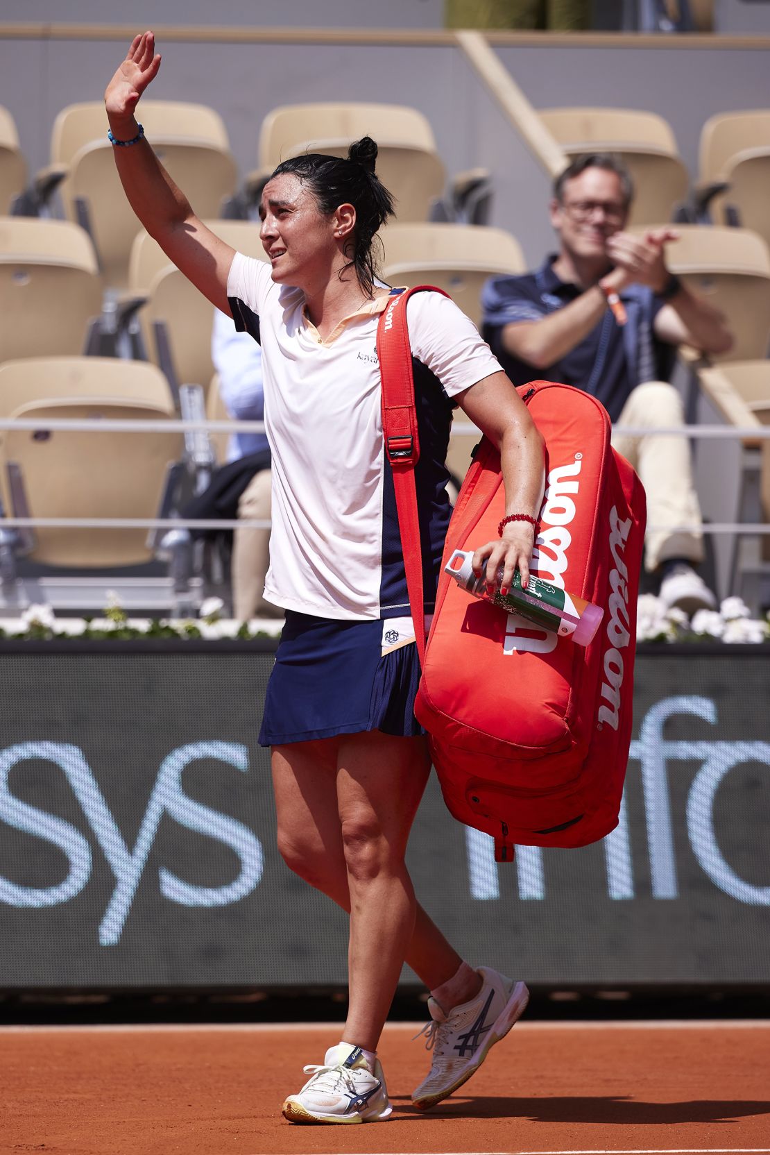 Jabeur leaves the court after her French Open quarterfinal loss to Coco Gauff.