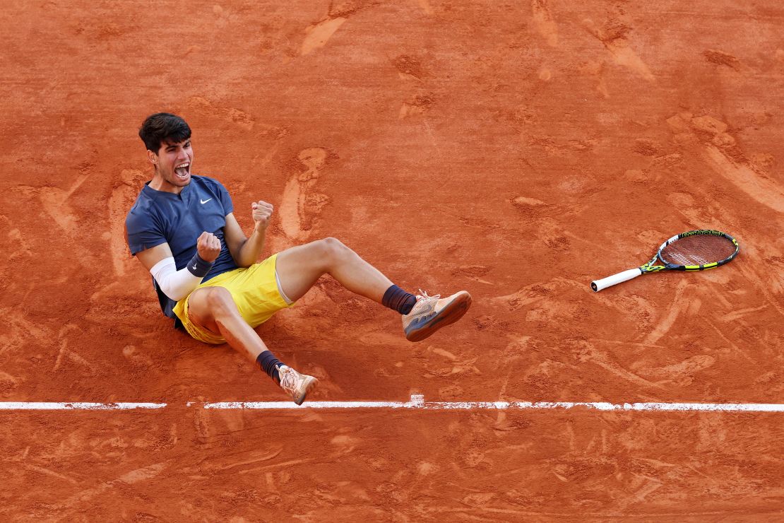 Alcaraz celebrates winning a third grand slam title -- all before his 22nd birthday.