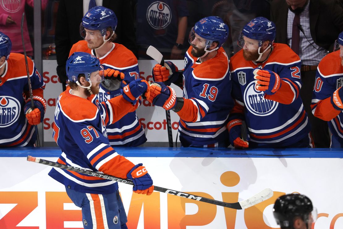 Connor McDavid celebrates with teammates after his goal.