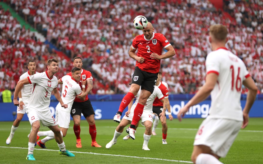 Gernot Trauner of Austria scores his team's first goal against Poland.