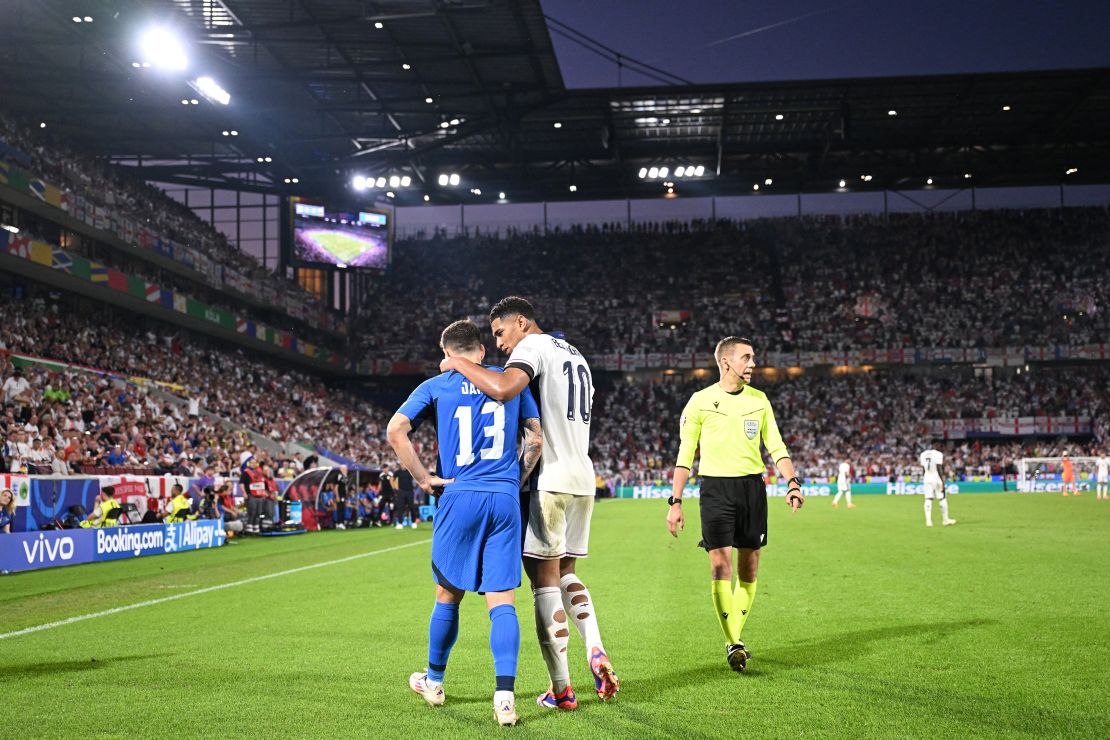 Slovenia defender Erik Janza and England midfielder Jude Bellingham chatting during the match.