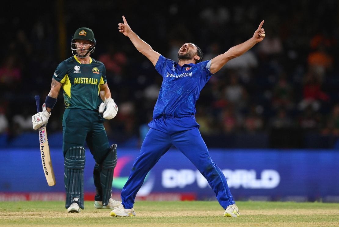 Gulbadin Naib celebrates after dismissing Glenn Maxwell of Australia.