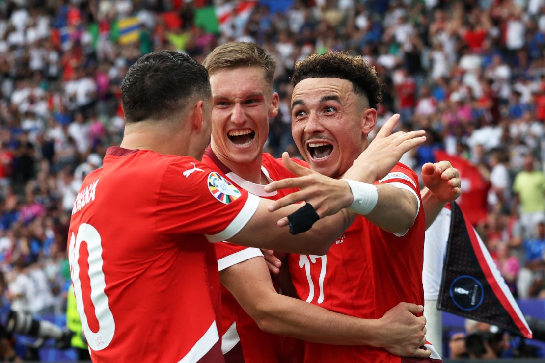 Vargas celebrates with his teammates after making it 2-0.