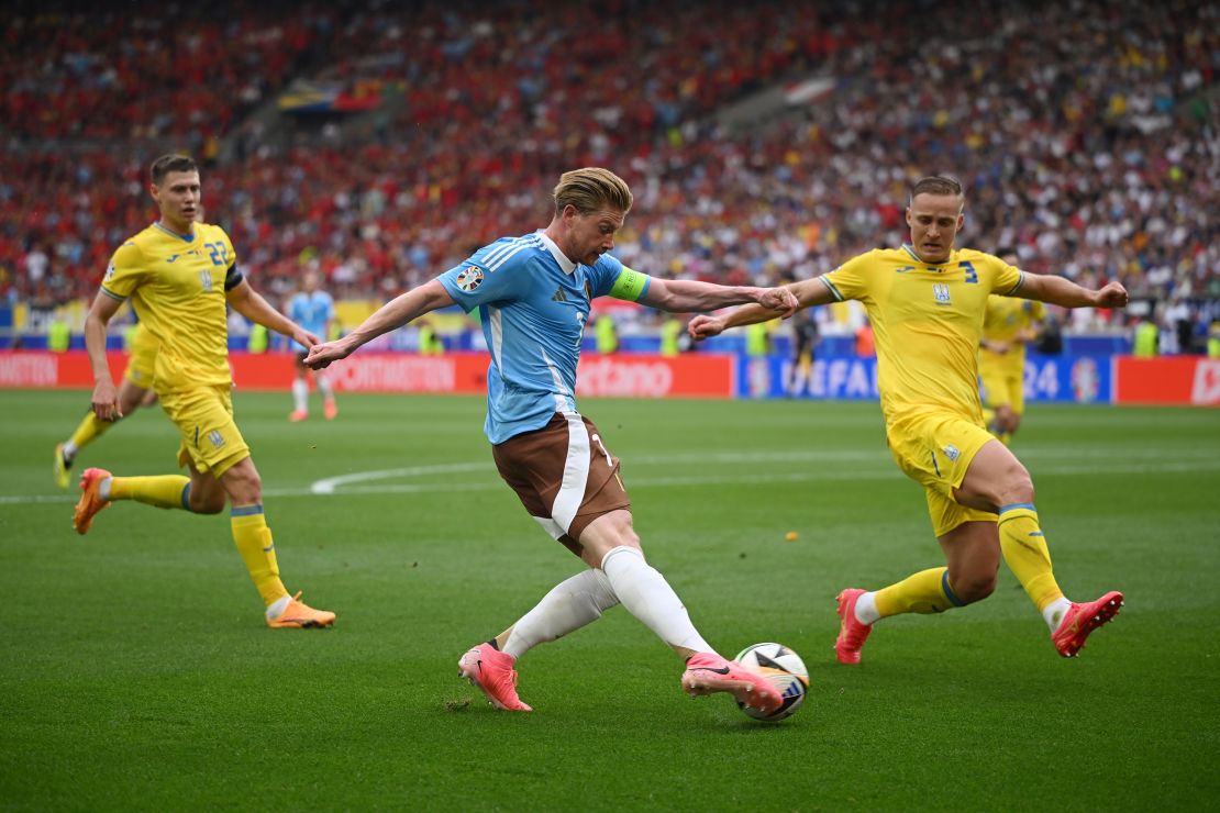 Kevin De Bruyne of Belgium crosses the ball during the UEFA EURO 2024 group stage match against Ukraine at Stuttgart Arena on June 26, 2024 in Stuttgart, Germany.