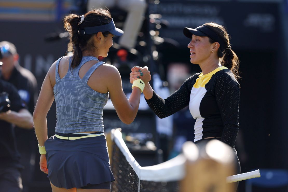 Raducanu and Pegula shake hands at the net.