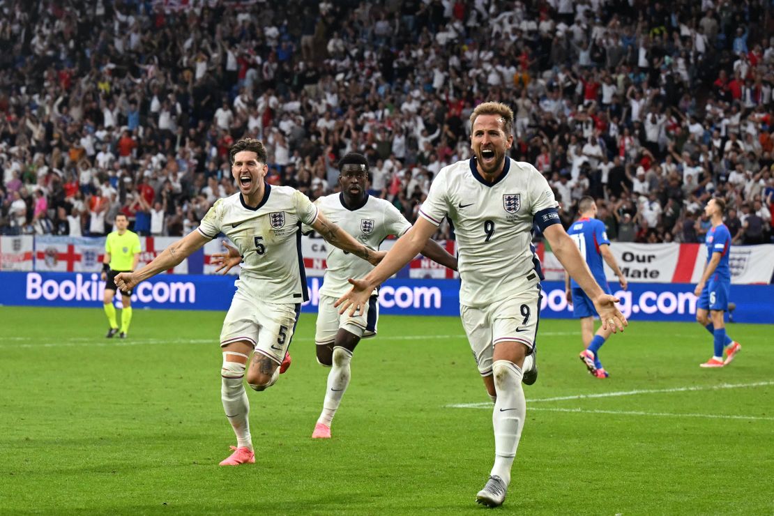 Kane celebrates scoring the winning goal for England against Slovakia.