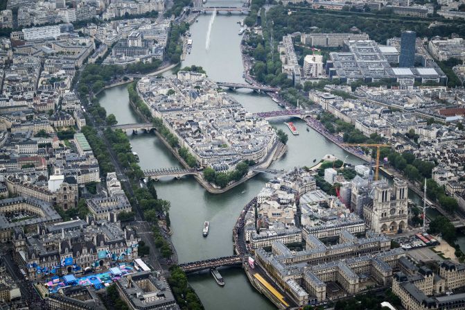 This aerial photo shows the Notre Dame cathedral as boats pass by on the Seine. As part of the opening ceremony, <a href="https://www.cnn.com/sport/live-news/paris-olympics-2024-opening-ceremony-seine#h_f4e1c79bb5cf9047ee74b7e7515bfe52">the bells of Notre Dame rang for the first time</a> since the iconic cathedral was gutted by fire in 2019. It is 90% restored.