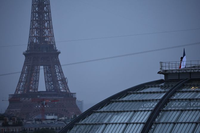 French mezzo-soprano opera singer Axelle Saint-Cirel <a href="https://www.cnn.com/sport/live-news/paris-olympics-2024-opening-ceremony-seine#h_c314aa00e3b25d6981ba1fc0127ac82b">performs "La Marseillaise,"</a> France's national anthem, on the roof of the Grand Palais.