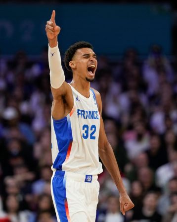 French basketball superstar Victor Wembanyama celebrates a Brazil turnover during the teams' opening game on July 27. Wembanyama had 19 points, nine rebounds, two assists, four steals and three blocks as <a href="https://www.cnn.com/sport/live-news/paris-olympics-news-2024-07-27#h_adc7279c0a5db023f742855ffd868995">France won 78-66</a>.