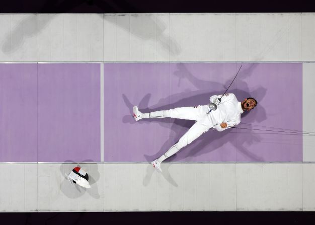 Egyptian fencer Mohamed El-Sayed celebrates after winning the bronze-medal épée bout on July 28.