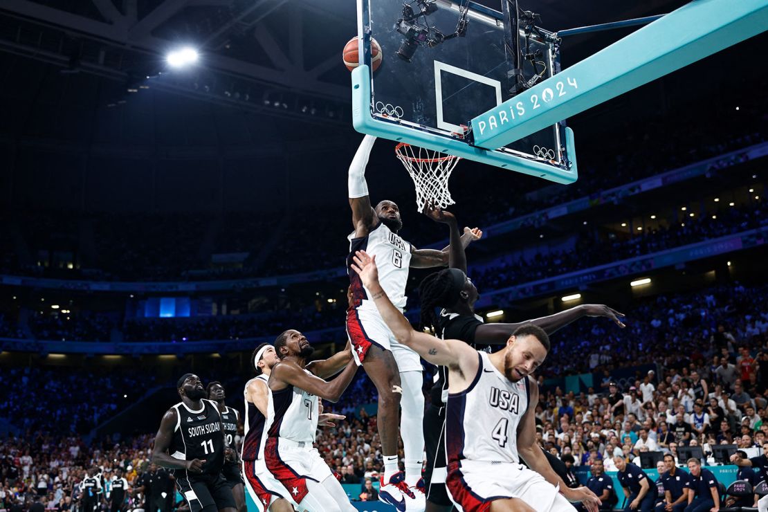 USA's #06 LeBron James takes a rebound in the men's preliminary round group C basketball match between USA and South Sudan during the Paris 2024 Olympic Games at the Pierre-Mauroy stadium in Villeneuve-d'Ascq, northern France, on July 31, 2024.