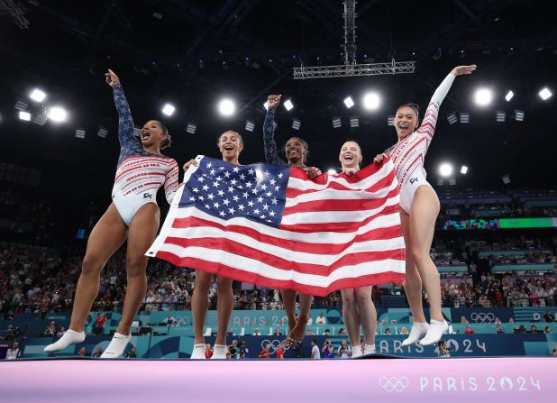 From left, American gymnasts Jordan Chiles, Hezly Rivera, Simone Biles, Jade Carey and Suni Lee celebrate after winning the gold medal at the Paris Olympics on Tuesday, July 30.