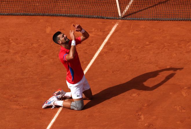 Serbia's Novak Djokovic celebrates match point against Carlos Alcaraz in the men's singles tennis final on August 4. This was Djokovic's first gold medal and earned him a <a href="https://www.cnn.com/2024/07/27/sport/novak-djokovic-paris-olympics-matthew-ebden-spt-intl/index.html">career golden slam</a>.