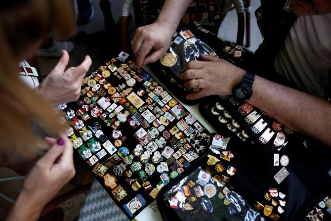 People trade Olympics-themed pins on August 2.