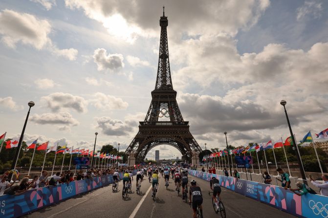 Riders start the men's cycling road race at the foot of the Eiffel Tower on August 3.