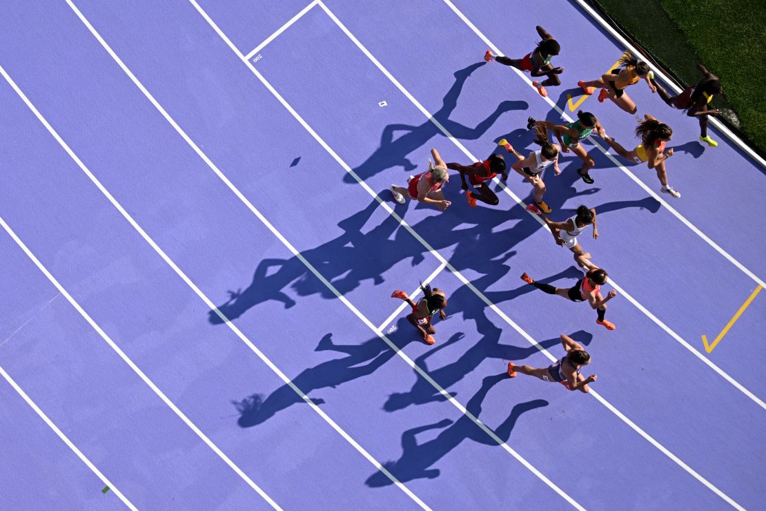 An overview shows athletes competing in the women's 5000m heat of the athletics event at the Paris 2024 Olympic Games at Stade de France in Saint-Denis, north of Paris, on August 2, 2024.