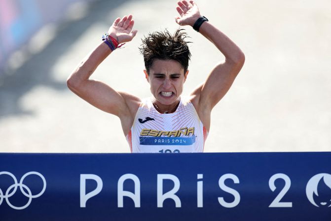 Spain's María Pérez crosses the finish line <a href="https://www.cnn.com/sport/live-news/paris-olympics-news-2024-08-07#h_64c55bb3631025c464b94926361b5446">to win gold in the marathon mixed relay race walk</a> on August 7. Her partner was Álvaro Martín.