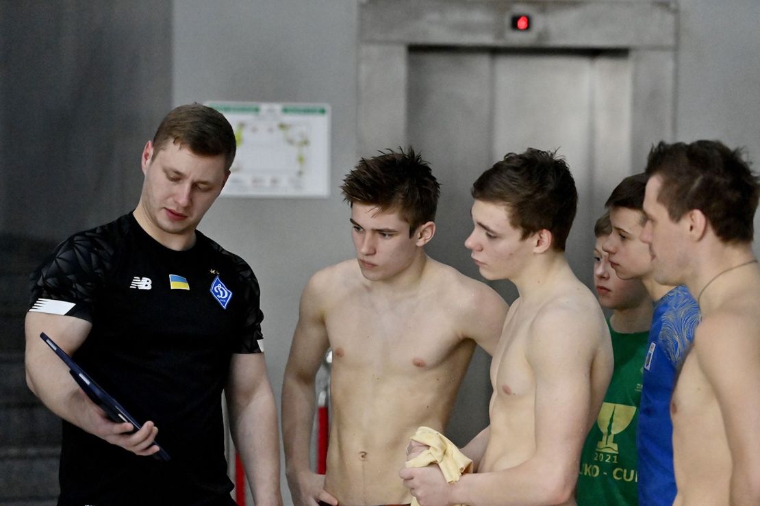 National diving team coach Ilya Tselutin with team members.