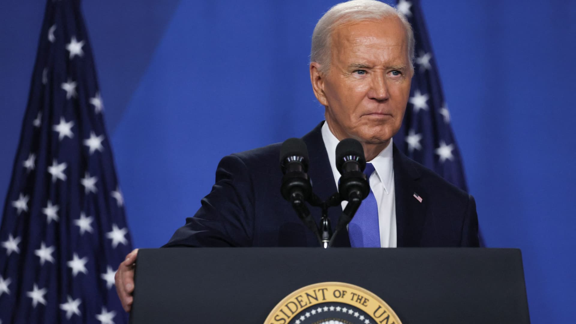 Biden touts cooling inflation, slams Trump tariffs at press conference