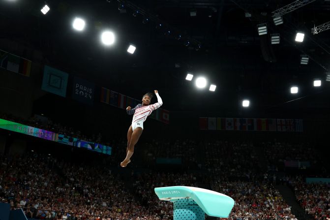 Biles twists through the air during her vault at the beginning of the competition. <a href="https://www.cnn.com/sport/live-news/paris-olympics-news-2024-07-30#h_c3ac600093a8e4f8edb5281d23b80a3d">She scored an incredible 14.900</a> and stuck her landing with no sign of any pain in her left leg that was so closely watched.