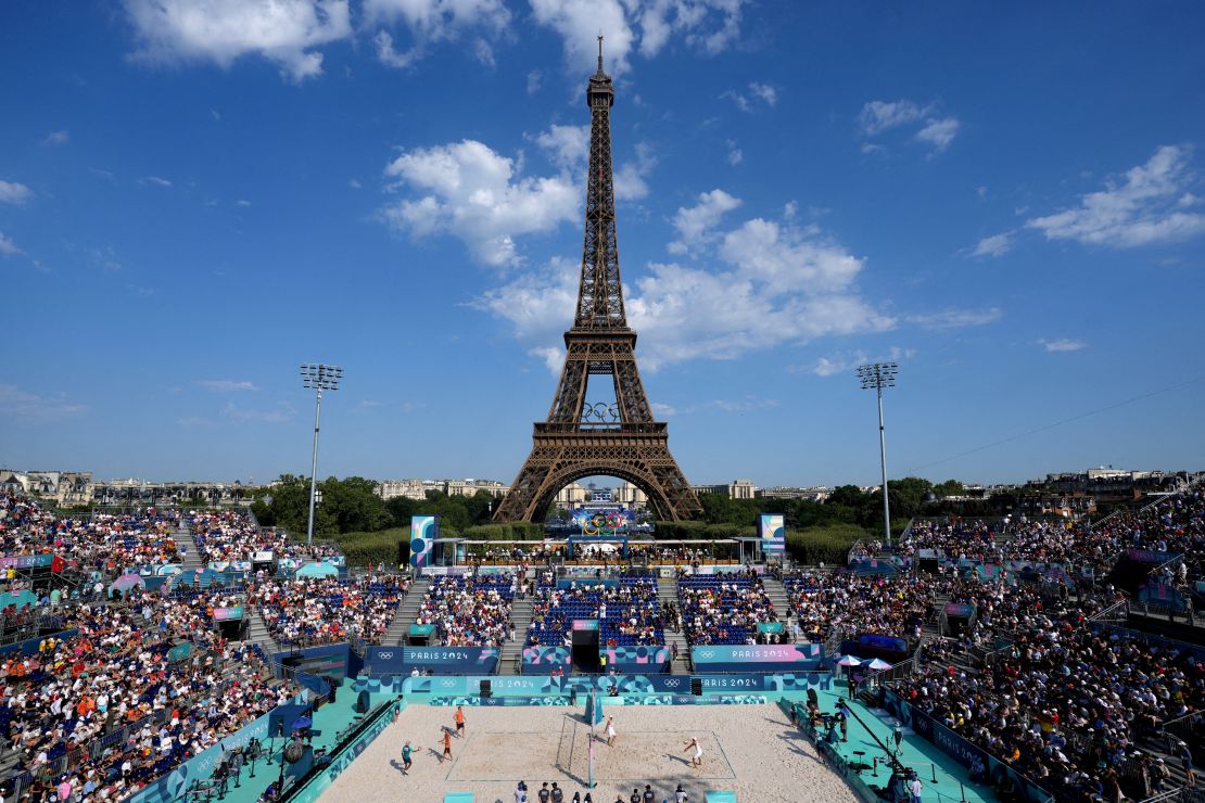 General view of the Eiffel Tower Stadium showing the Eiffel Tower with the Olympic rings and spectators in the stands before the game.